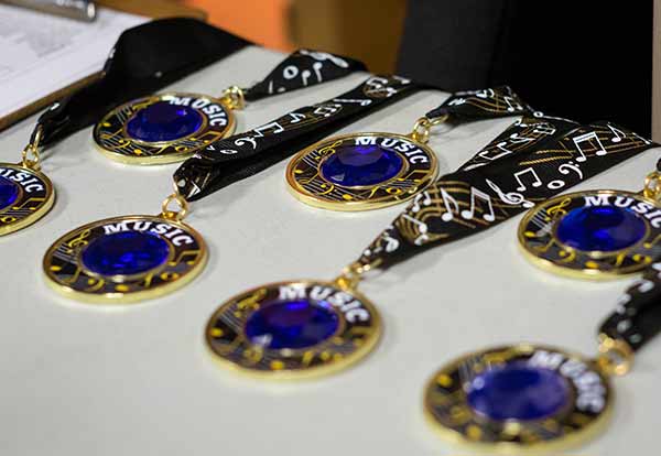 medals of kids in music school