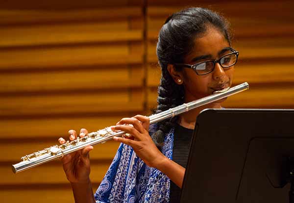 girl playing flute in excel music