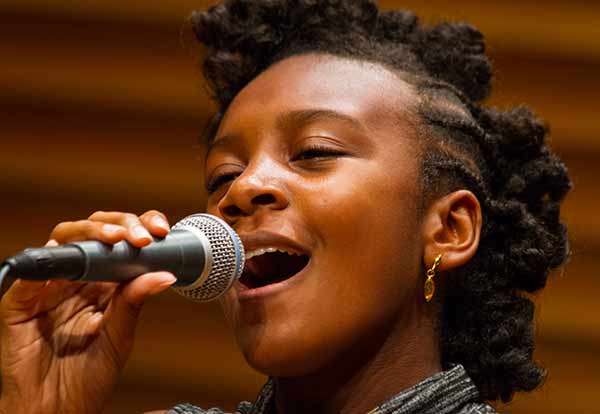 girl singing in music class