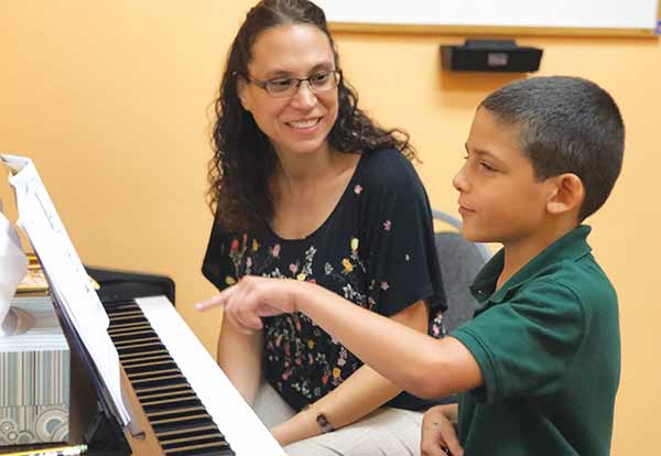 kid having music lessons
