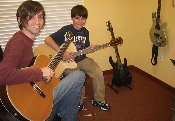 kids having guitar lessons
