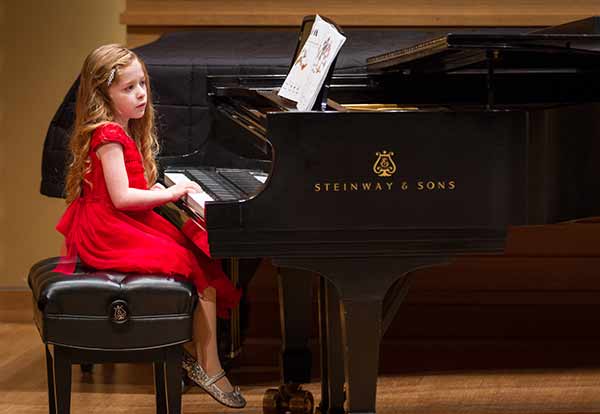 girl kid playing piano